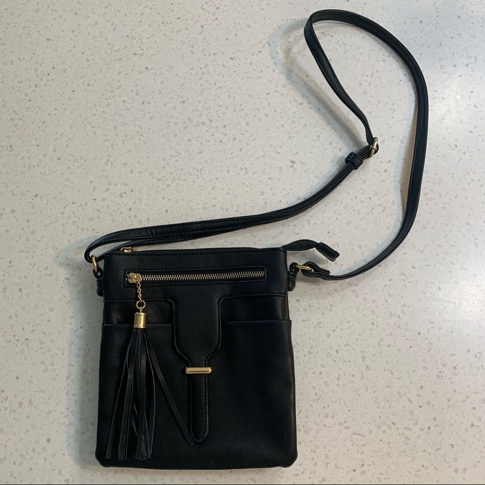 Black and gold crossbody with tassel charm